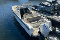 2020 Nimbus T8 boat docked in marina, featuring sleek design and modern outboard motor.