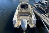 2020 Nimbus T8 boat docked on calm water, rear view.