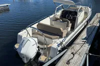 2020 Nimbus T8 motorboat docked, featuring a sleek design and spacious seating.