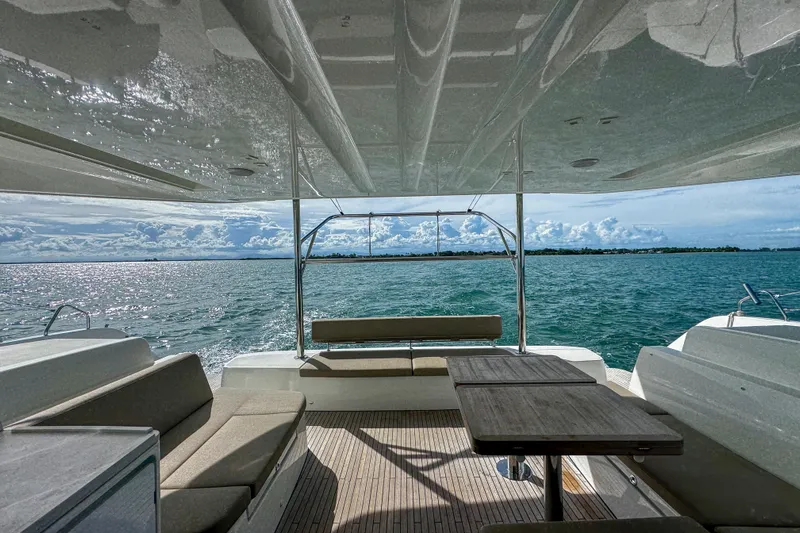 Bellissima Yacht Photos Pics Luxurious 2024 Lagoon 51 yacht interior with ocean view and comfortable seating.