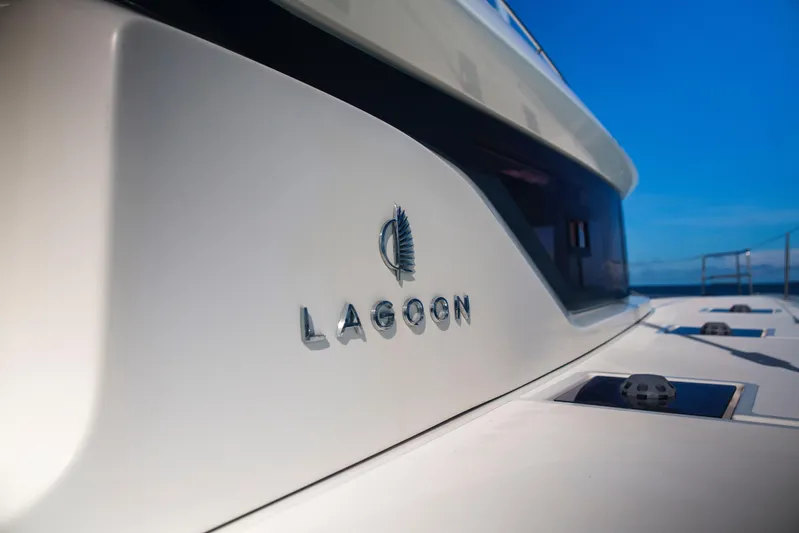 Bellissima Yacht Photos Pics 2024 Lagoon 51 yacht, sleek design with logo, against a clear blue sky.