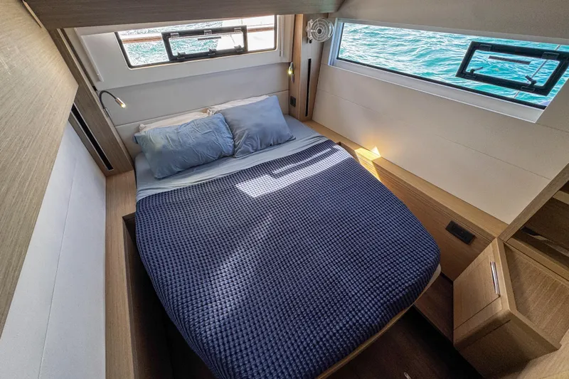 Bellissima Yacht Photos Pics Luxurious cabin interior of 2024 Lagoon 51 yacht with ocean view windows.