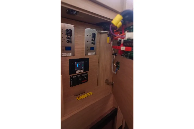 Bellissima Yacht Photos Pics 2024 Lagoon 51 yacht electrical panel with wiring and control displays.