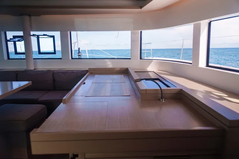 Bellissima Yacht Photos Pics Interior of 2024 Lagoon 51 yacht with ocean view through large windows.