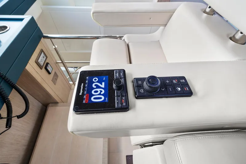 Knot @ Work Yacht Photos Pics Control panel on Monte Carlo Yachts MCY 76 Skylounge, 2021 model, featuring navigation instruments.