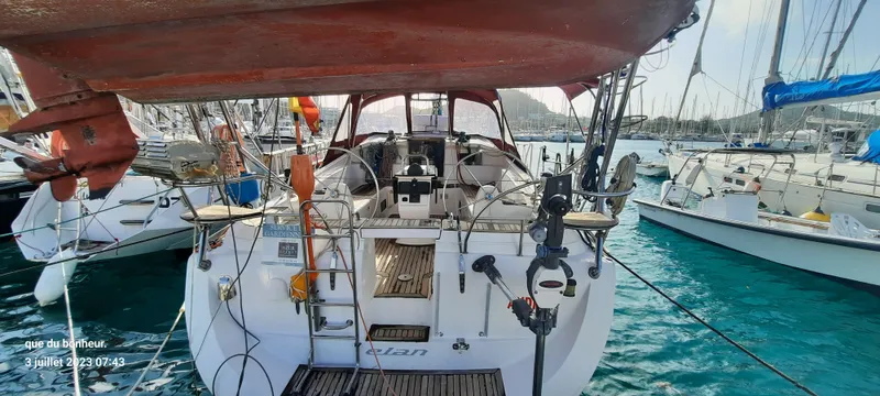  Yacht Photos Pics 2007 Elan Impression 434 yacht docked in a marina, surrounded by clear blue water.