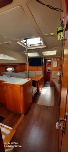  Yacht Photos Pics Interior of 2007 Elan Impression 434 yacht with wood finish and seating area.