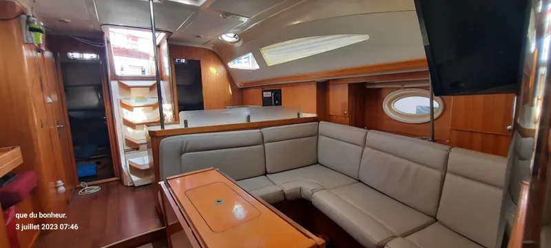  Yacht Photos Pics Spacious interior of 2007 Elan Impression 434 yacht with comfortable seating and wooden finishes.