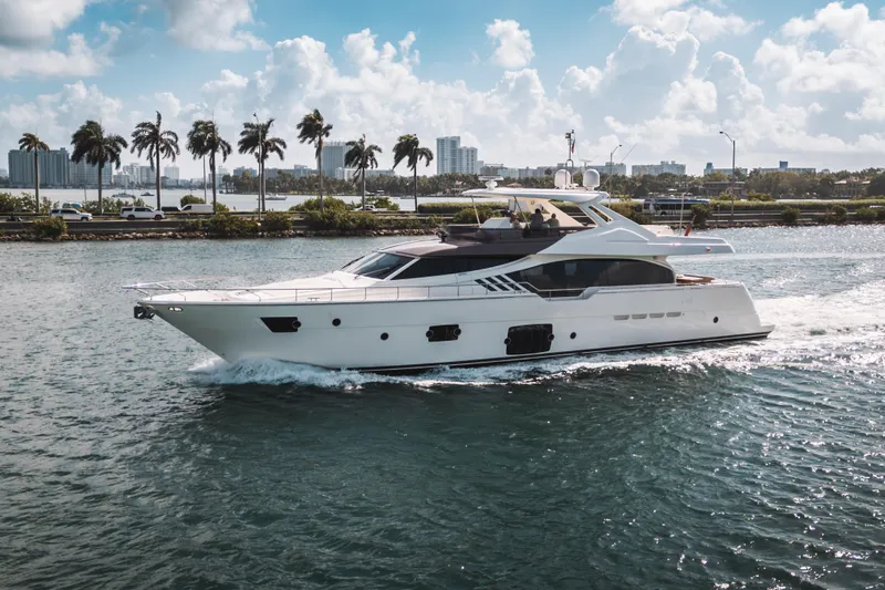 Lady Nelly Yacht Photos Pics Luxurious 2014 Ferretti Yachts 870 cruising on a scenic waterway with palm trees.