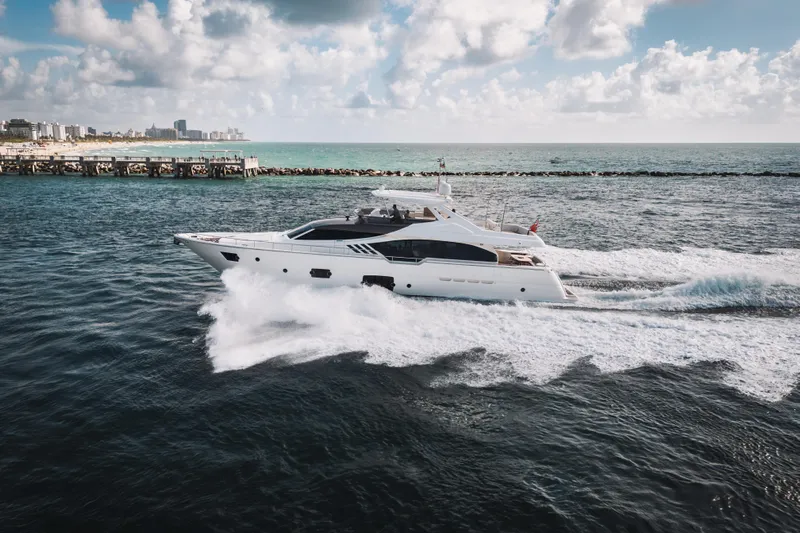 Lady Nelly Yacht Photos Pics 2014 Ferretti Yachts 870 cruising on the ocean near a coastal city.