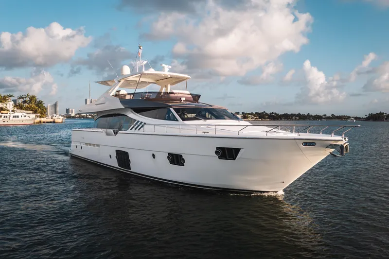 Lady Nelly Yacht Photos Pics Luxurious 2014 Ferretti Yachts 870 cruising on a sunny day, showcasing sleek design.