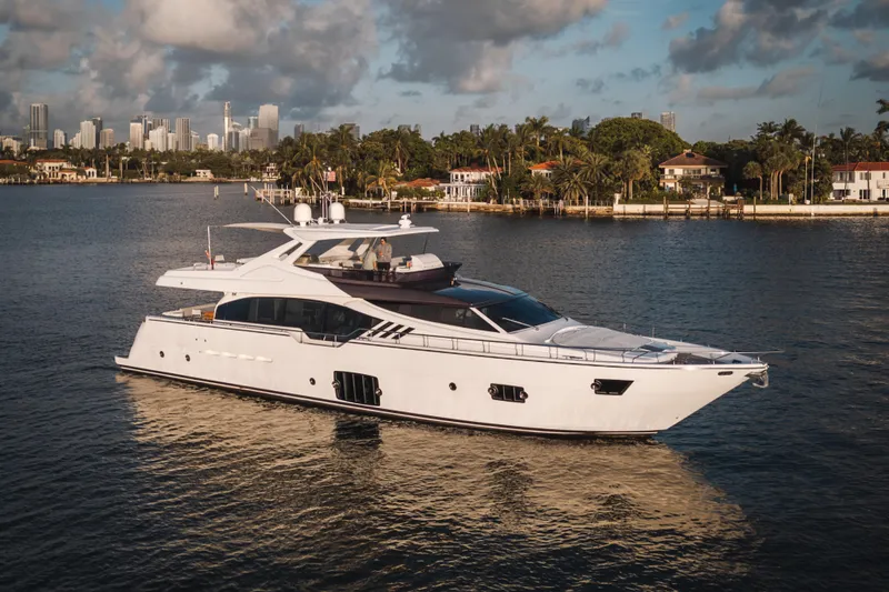 Lady Nelly Yacht Photos Pics 2014 Ferretti Yachts 870 cruising near a coastal city skyline.