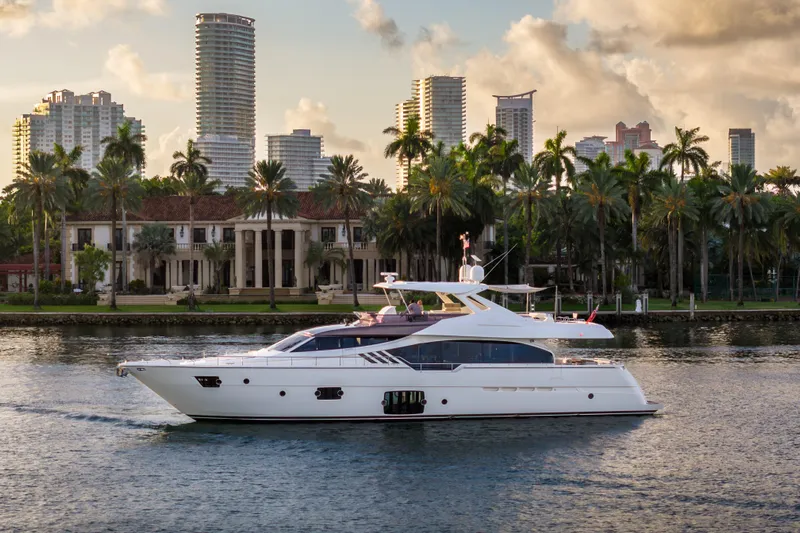 Lady Nelly Yacht Photos Pics Luxurious 2014 Ferretti Yachts 870 cruising near a tropical city skyline.