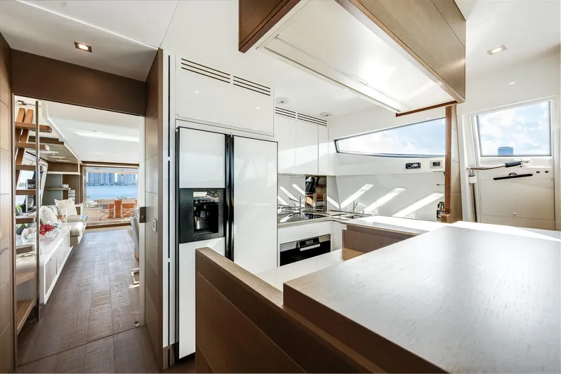 Lady Nelly Yacht Photos Pics Luxurious interior of 2014 Ferretti Yachts 870, featuring modern kitchen and spacious living area.