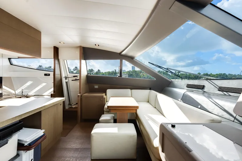 Lady Nelly Yacht Photos Pics Luxurious interior of 2014 Ferretti Yachts 870 with modern seating and panoramic windows.
