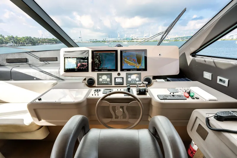 Lady Nelly Yacht Photos Pics Cockpit of 2014 Ferretti Yachts 870 with navigation screens and controls.