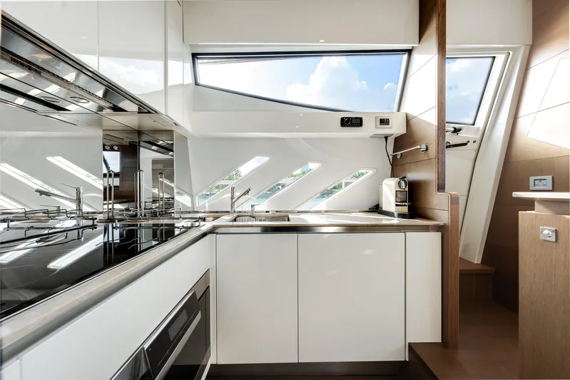Lady Nelly Yacht Photos Pics Luxurious kitchen interior of 2014 Ferretti Yachts 870, featuring modern appliances and sleek design.