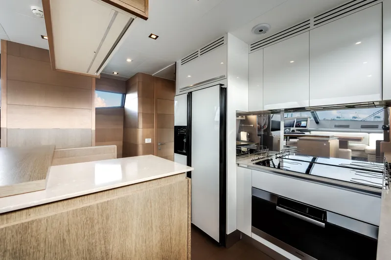 Lady Nelly Yacht Photos Pics Luxurious kitchen interior of 2014 Ferretti Yachts 870, featuring modern appliances and sleek design.
