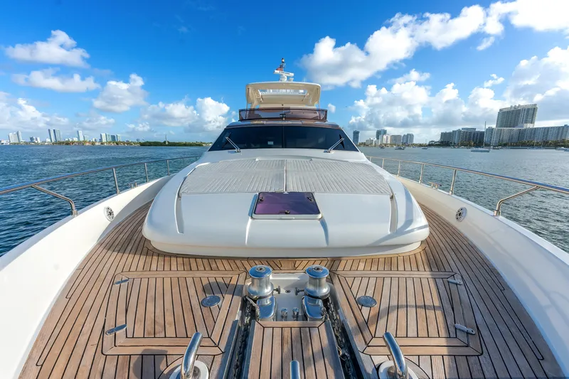 Lady Nelly Yacht Photos Pics Luxurious 2014 Ferretti Yachts 870 on serene waters with city skyline backdrop.