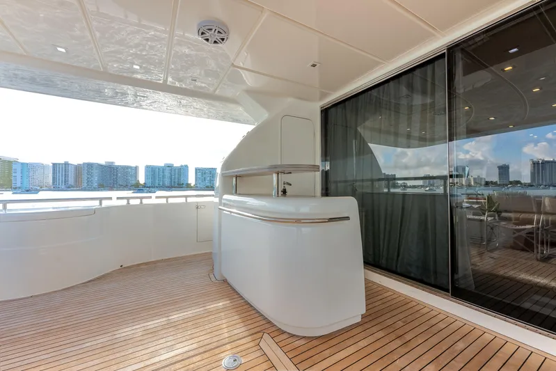 Lady Nelly Yacht Photos Pics Luxurious deck of 2014 Ferretti Yachts 870 with sleek bar and cityscape view.