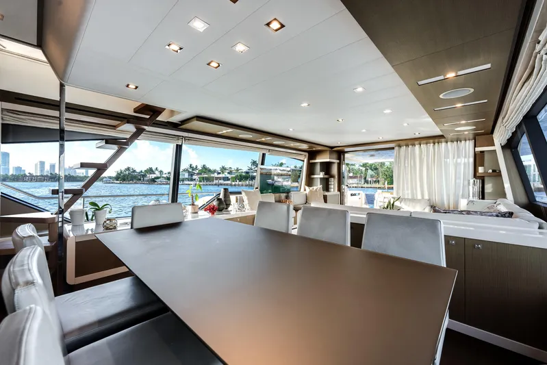 Lady Nelly Yacht Photos Pics Luxurious interior of 2014 Ferretti Yachts 870 with elegant dining area and scenic views.