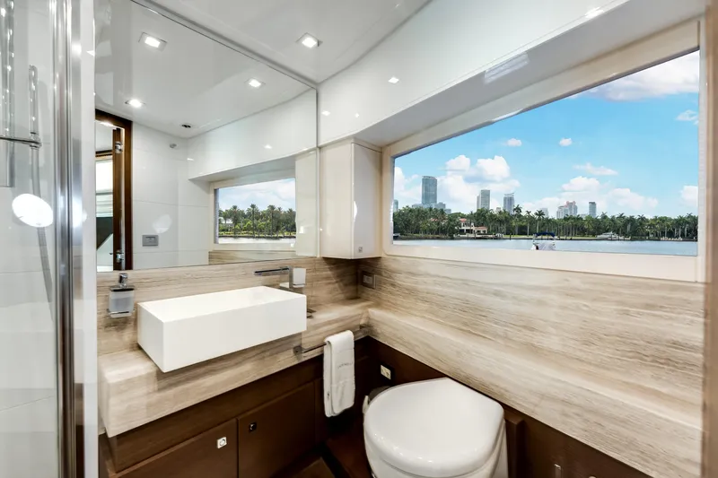 Lady Nelly Yacht Photos Pics Luxurious bathroom interior of 2014 Ferretti Yachts 870 with scenic window view.