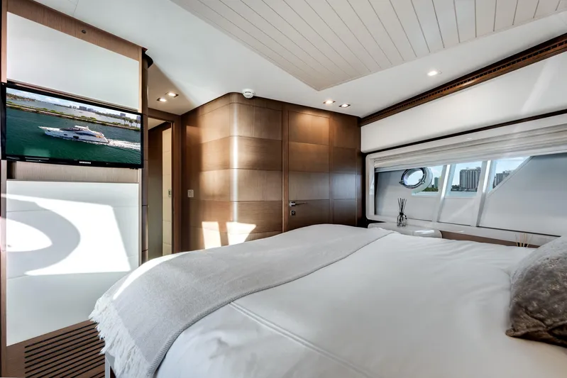 Lady Nelly Yacht Photos Pics Luxurious bedroom interior of 2014 Ferretti Yachts 870 with modern design and scenic window view.