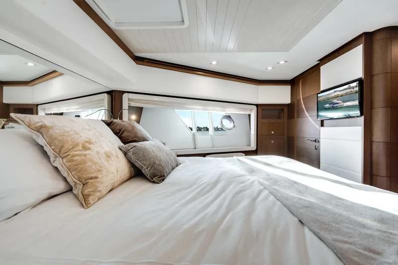 Lady Nelly Yacht Photos Pics Luxurious bedroom interior of 2014 Ferretti Yachts 870 with elegant decor and modern amenities.
