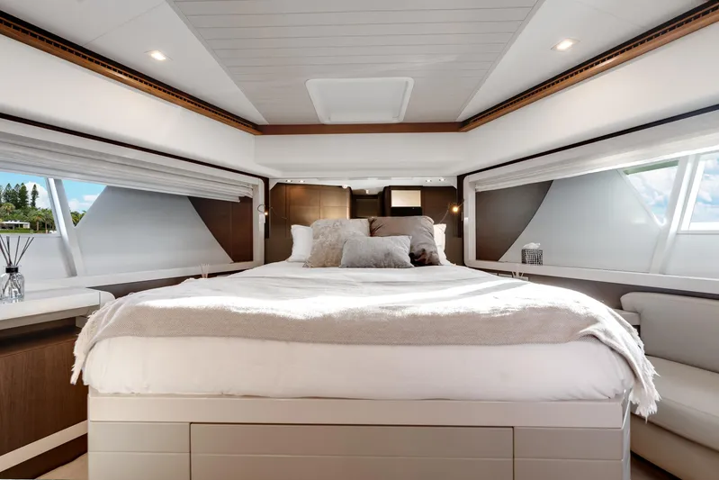 Lady Nelly Yacht Photos Pics Luxurious bedroom interior of 2014 Ferretti Yachts 870 with elegant bedding and natural light.