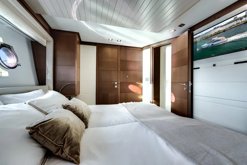 Lady Nelly Yacht Photos Pics Luxurious bedroom interior of 2014 Ferretti Yachts 870 with elegant wood paneling and modern decor.