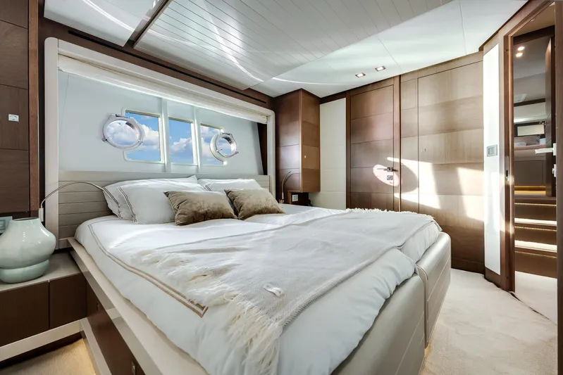 Lady Nelly Yacht Photos Pics Luxurious bedroom interior on 2014 Ferretti Yachts 870, featuring elegant design and natural light.