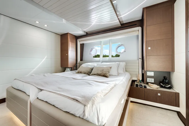 Lady Nelly Yacht Photos Pics Luxurious bedroom interior on 2014 Ferretti Yachts 870, featuring elegant design and cozy bedding.