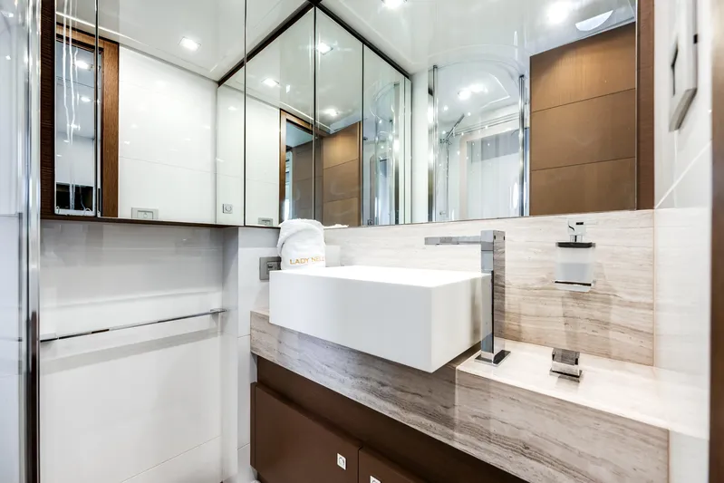 Lady Nelly Yacht Photos Pics Luxurious bathroom interior on 2014 Ferretti Yachts 870, featuring modern sink and mirrored cabinets.
