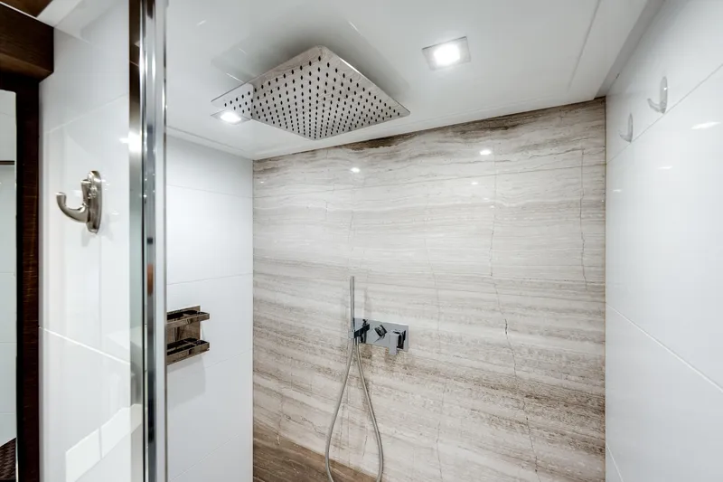 Lady Nelly Yacht Photos Pics Luxurious shower in 2014 Ferretti Yachts 870, featuring modern fixtures and elegant tile design.