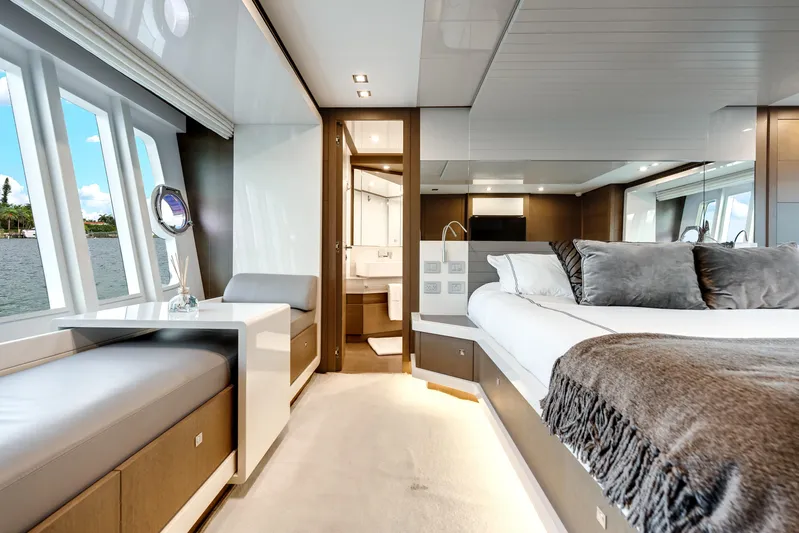 Lady Nelly Yacht Photos Pics Luxurious interior of 2014 Ferretti Yachts 870, featuring elegant bedroom and scenic windows.