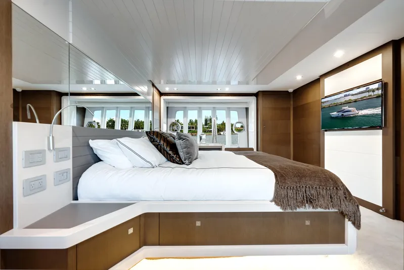 Lady Nelly Yacht Photos Pics Luxurious bedroom interior of 2014 Ferretti Yachts 870 with modern design and scenic window view.