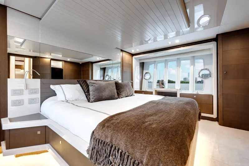 Lady Nelly Yacht Photos Pics Luxurious bedroom interior of 2014 Ferretti Yachts 870 with elegant design and waterfront view.