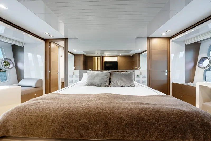 Lady Nelly Yacht Photos Pics Luxurious bedroom interior of 2014 Ferretti Yachts 870, featuring elegant design and modern amenities.
