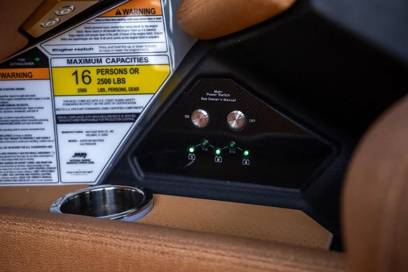  Yacht Photos Pics 2024 Nautique Super Air Nautique G23 Paragon dashboard with capacity warning and controls.