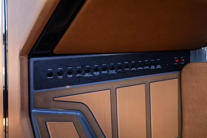  Yacht Photos Pics 2024 Nautique Super Air Nautique G23 Paragon control panel with switches and buttons.