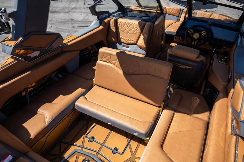  Yacht Photos Pics 2024 Nautique Super Air Nautique G23 Paragon interior with luxurious tan seating and modern design.