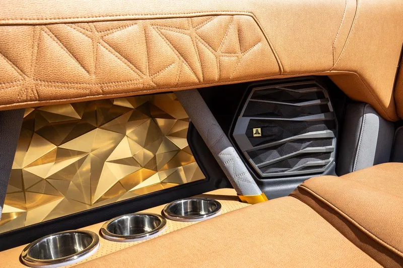  Yacht Photos Pics 2024 Nautique Super Air Nautique G23 Paragon interior with luxury seating and speaker detail.