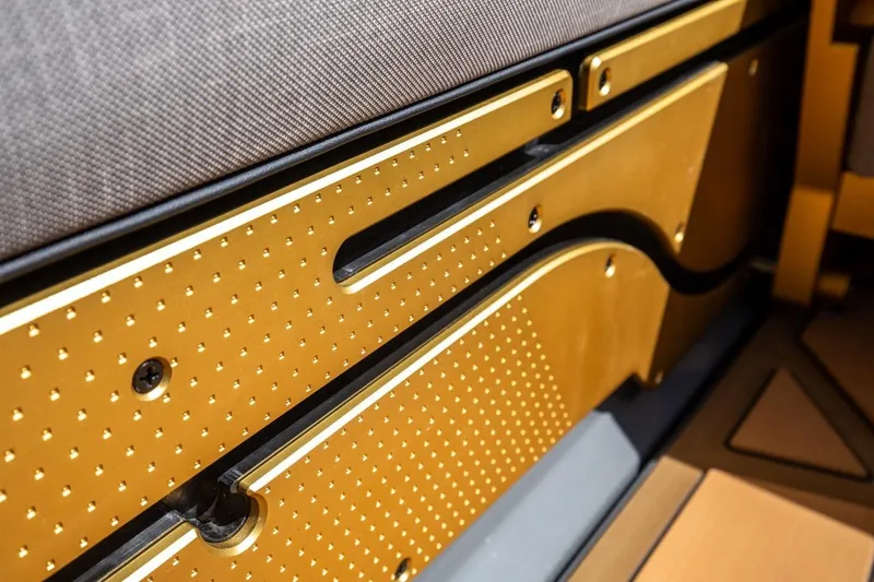  Yacht Photos Pics 2024 Nautique Super Air Nautique G23 Paragon interior detail with gold accents and textured design.