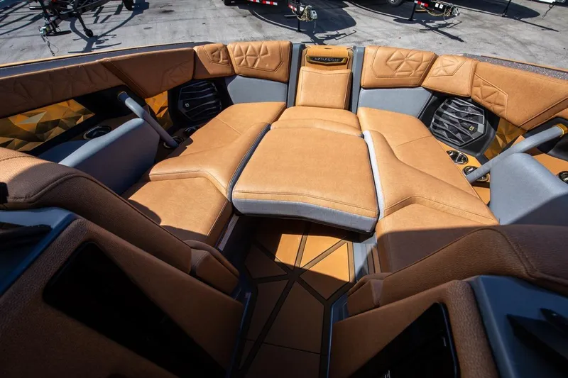  Yacht Photos Pics 2024 Nautique Super Air Nautique G23 Paragon interior with luxurious tan seating.