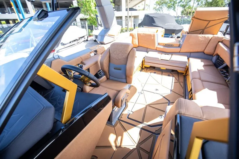  Yacht Photos Pics Luxurious interior of 2024 Nautique Super Air Nautique G23 Paragon boat, featuring premium seating.