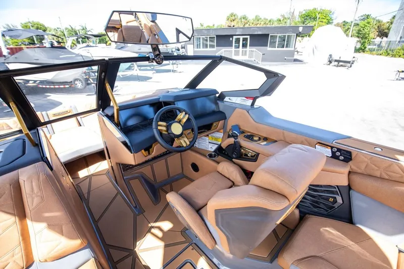  Yacht Photos Pics 2024 Nautique Super Air Nautique G23 Paragon interior with luxurious seating and modern dashboard.