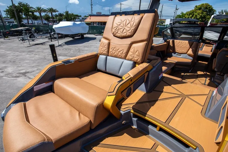  Yacht Photos Pics 2024 Nautique Super Air Nautique G23 Paragon interior with luxurious tan seating and modern design.