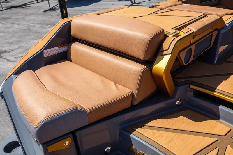  Yacht Photos Pics 2024 Nautique Super Air Nautique G23 Paragon boat seating with tan upholstery and sleek design.