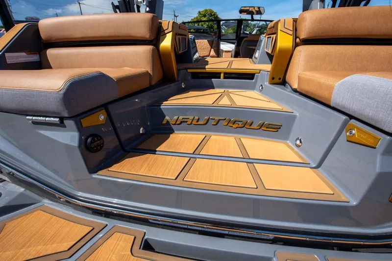  Yacht Photos Pics 2024 Nautique Super Air Nautique G23 Paragon interior with luxurious seating and stylish flooring.