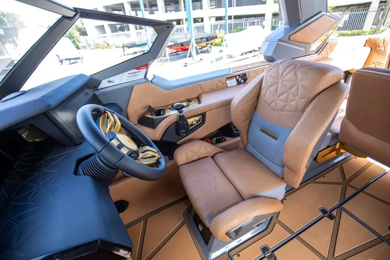  Yacht Photos Pics 2024 Nautique Super Air Nautique G23 Paragon interior with luxurious seating and modern dashboard.